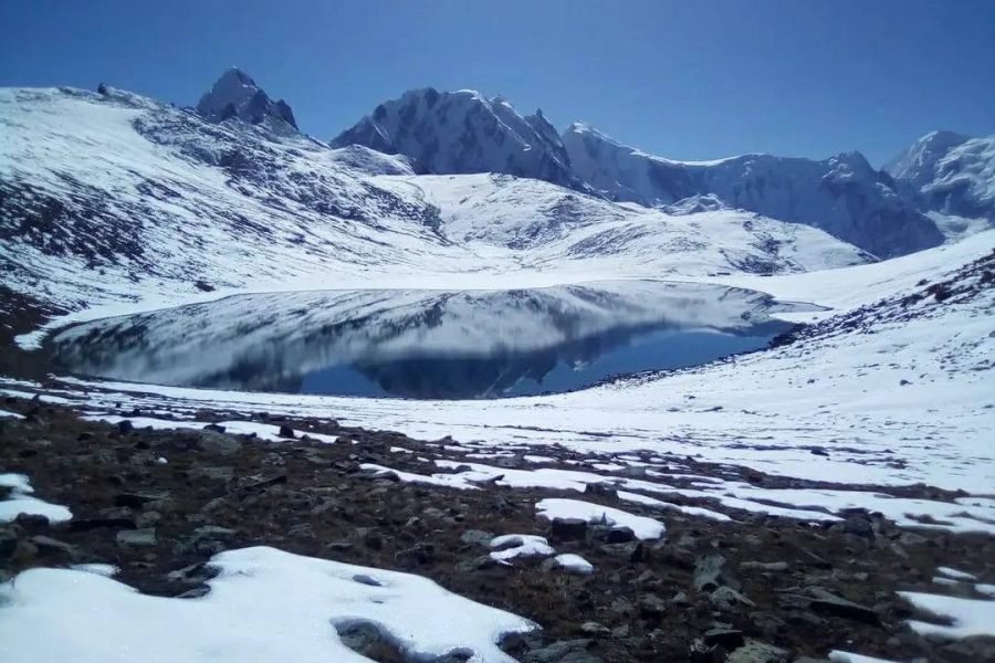 Alt text: Rush Lake in Nagar Valley, Gilgit-Baltistan, surrounded by the high peaks of the Karakoram Mountains.